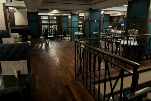 an empty room with a staircase and a table at Norfolk Waterside Marriott in Norfolk