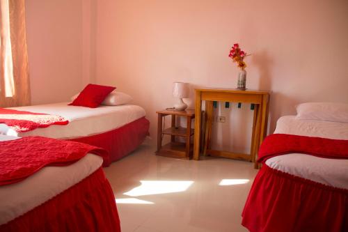 Letto o letti in una camera di Cielo Azul Galápagos Hotel