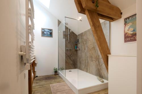 a bathroom with a shower with a glass door at Le Loft Nantais - Superbe Loft de 300m² in Nantes