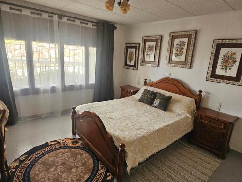 a bedroom with a bed and a window at Suitte rústica in Begur