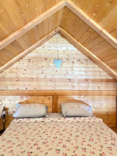 a bedroom with a bed in a attic at Bird of Paradise in Belgrade