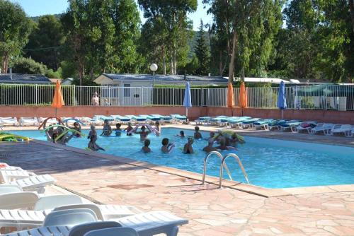 a group of people in a swimming pool at Camping maeva Escapades Parc Valrose in La Londe-les-Maures