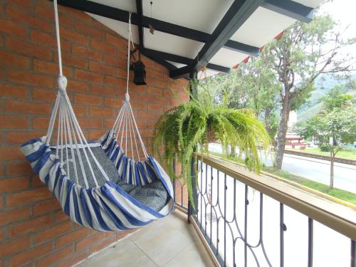 a hammock hanging from a brick wall at Apartamento 8-27 in Líbano