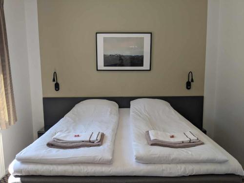 Postel nebo postele na pokoji v ubytování Hotel Thisted