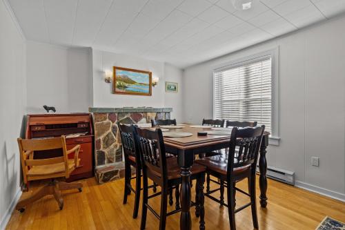 a dining room with a table and chairs at Historic 3br W Modern Comforts In Holyrood in Holyrood