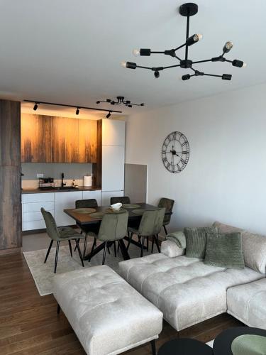 a living room with a couch and a table at LiboroPlanet in Niš