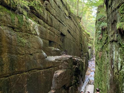 a group of people standing next to a rock wall at 80PVR Log Home 20min to Bretton Woods AC Hot Tub wifi cable fireplace fire pit in Bethlehem