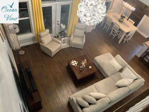 an overhead view of a living room and dining room at Scenic Seal Cove Nature Retreat Hot Tubatv Trail in Holyrood