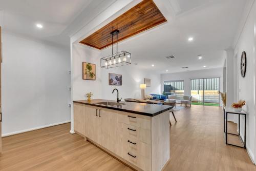 a kitchen with a sink and a counter top at Amukta nook in Truganina