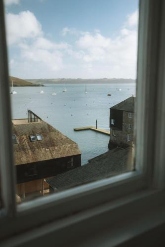 a view of a body of water from a window at The Old Captains Lookout in Falmouth