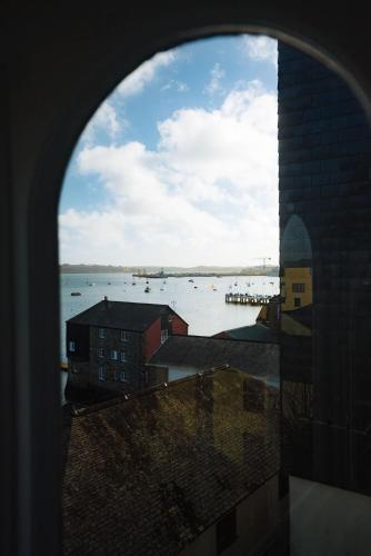 a view of a body of water from a window at The Old Captains Lookout in Falmouth