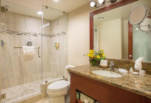 a bathroom with a toilet and a sink and a shower at Coast Anabelle Hotel in Burbank