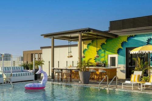 a swimming pool with a swan in the water at Moxy St. Petersburg Downtown in St. Petersburg