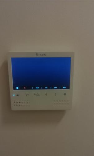 a computer monitor hanging on a wall at Valmere Members Luxury Sea View Apartment Tivat in Tivat