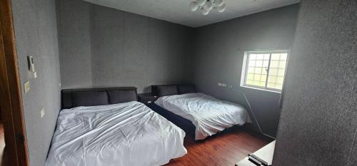 Yawen Homestay 雅文民宿にあるベッド