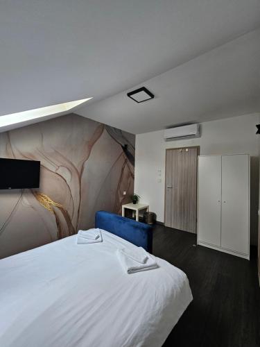 Postel nebo postele na pokoji v ubytování KAPTOL Rooms