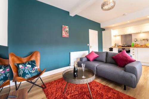 a living room with a couch and a table at King Street Penthouse - 2 Bed in Great Yarmouth