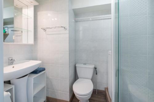 a bathroom with a toilet and a sink and a shower at AS25806-P2 cabine duplex avec terrasse et parking in Le Grau-du-Roi