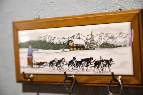 a picture of a painting of a man in a sleighdrawn at Charmant studio en montagne à Allevard - 30 m² avec balcon in Allevard