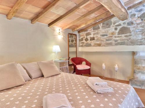 Ένα ή περισσότερα κρεβάτια σε δωμάτιο στο Nuovissimo Loft panoramico con giardino a Montalcino