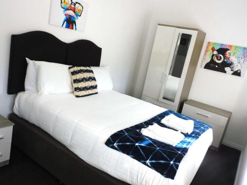Ένα ή περισσότερα κρεβάτια σε δωμάτιο στο No 1 - 2 bedroom apartment in Lanark Town Centre