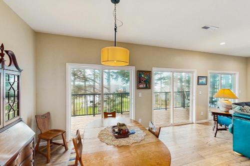a living room with a table and chairs at Coastal View Escape in Cannon Beach