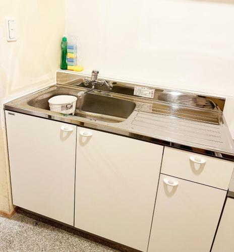 a kitchen with a sink and a counter at Hananogo Ikebukuro - Vacation STAY 16071v in Tokyo