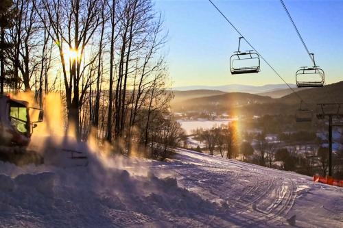 a snow covered ski slope with a ski lift at Sky Full Of Wishes in Quechee