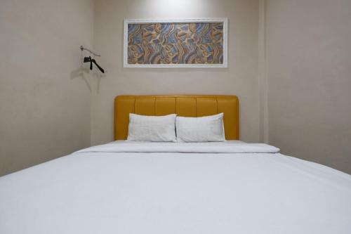 Postel nebo postele na pokoji v ubytování Grand Mulia Hotel Kisaran
