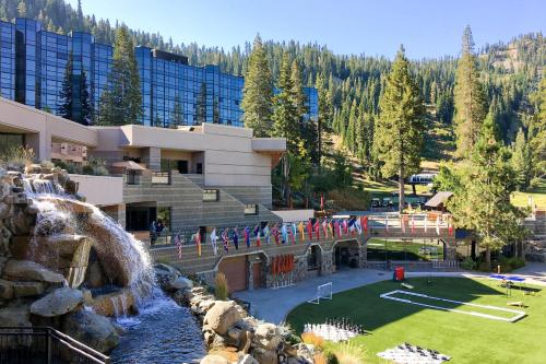 a resort with a waterfall and a water park at Everline #350 in Olympic Valley