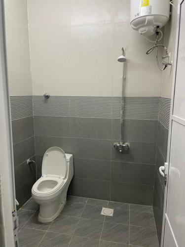 a bathroom with a toilet and a shower at Dafyat two bedrooms rental house in Dafīyāt