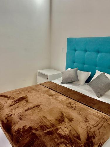 Ένα ή περισσότερα κρεβάτια σε δωμάτιο στο Hotel Cattaleya City