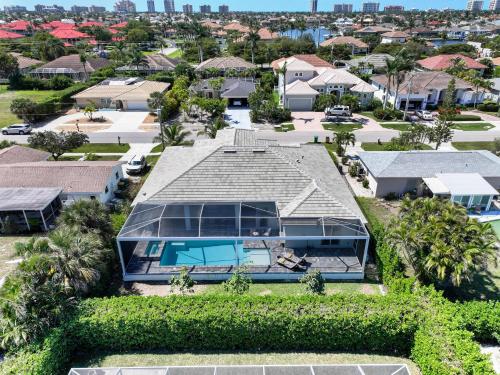 an aerial view of a house at 2023 custom built home with heated pool and hot tub in Marco Island
