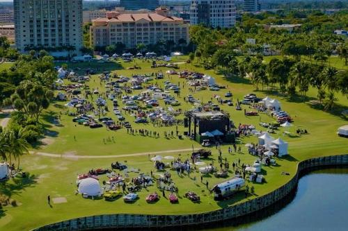 an aerial view of a park with people and tents at JW Marriott Miami Turnberry Resort & Spa in Aventura