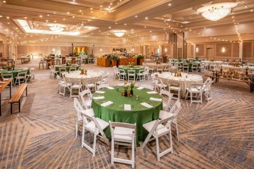 a banquet hall with white tables and chairs at JW Marriott Miami Turnberry Resort & Spa in Aventura