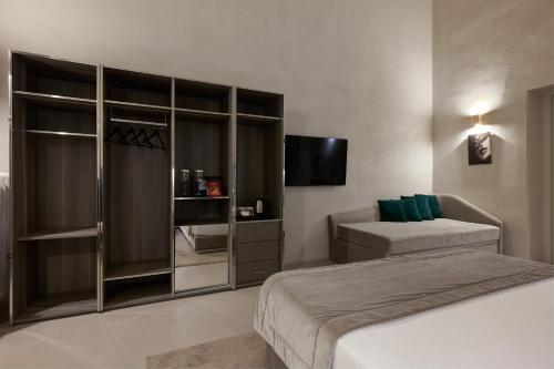 a hotel room with two beds and a tv at Terrace Pantheon Relais in Rome