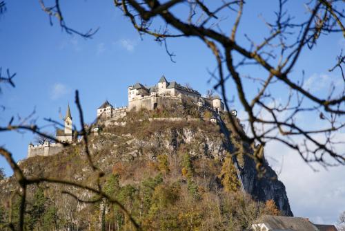 a castle on the top of a mountain at Stiglitzer Apartment in Sankt Martin