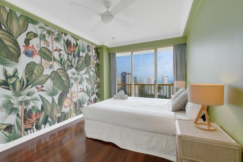 a bedroom with a bed and a large window at Stylish 1BR Beachside Escape - Heart of Gold Coast in Gold Coast