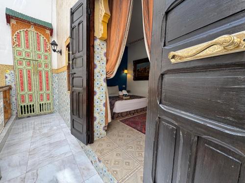 an open door to a room with a bathroom at RIAD ESMERALDA By Dar Ouezzani in Rabat
