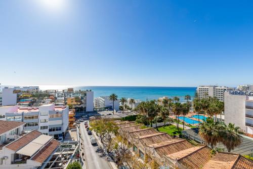 an aerial view of a city and the ocean at Apartamentos Doramar in Benalmádena