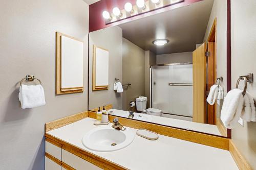 a bathroom with a sink and a mirror at Lake Chelan Shores: Lakeside Luxury #19-5 in Chelan