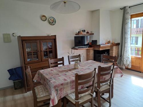 a kitchen and dining room with a table and chairs at Presolana Horizon in Castione della Presolana