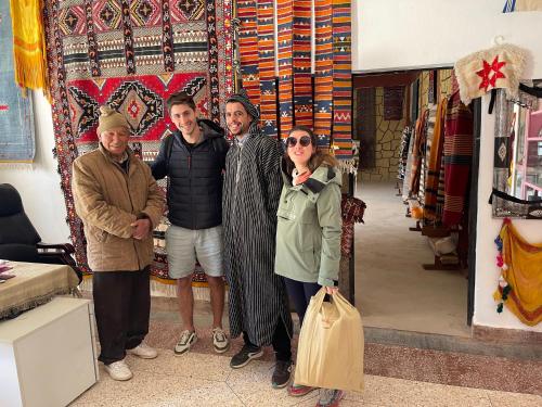 a group of people standing in front of a store at Dar Mgouna Roses in Kalaat MGouna