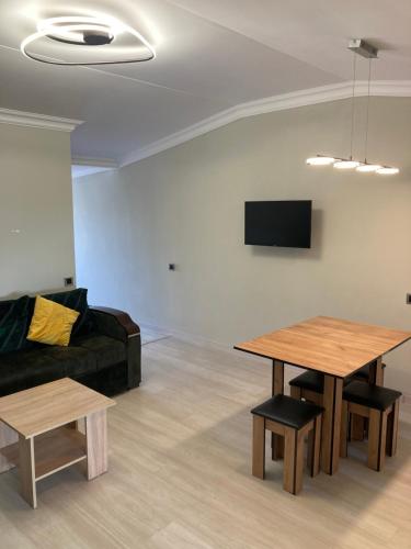 a living room with a couch and a table at Armen’s Apartment in Yerevan