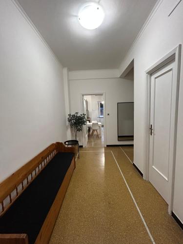 a living room with a couch and a tv and a door at A un passo da in Genova