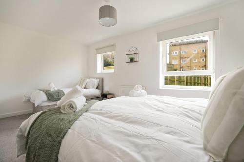 Ένα ή περισσότερα κρεβάτια σε δωμάτιο στο Yasmin's Townhouse - Sleeps upto 10, great for groups with FREE Parking - Hosted by Stay Host Save