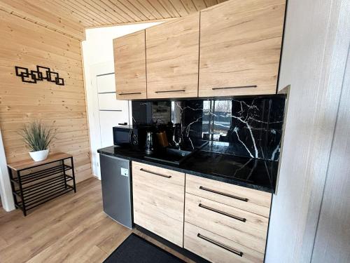 Η κουζίνα ή μικρή κουζίνα στο apartament z jacuzzi sępopol