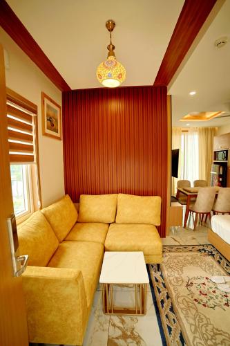 a living room with a couch and a table at S Cross Munroe Island Resort in Munroe Island