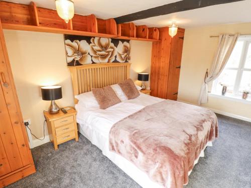 Katil atau katil-katil dalam bilik di Beech Cottage
