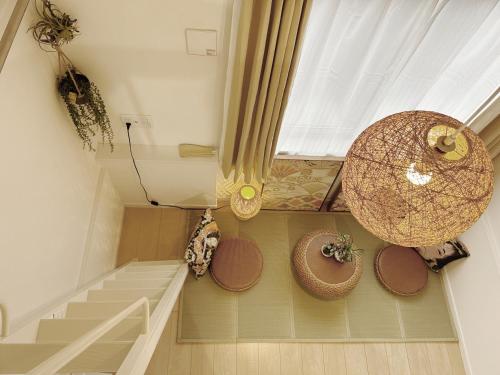 a room with stairs and a window and someitures at Shin-Koenji loft apartment close to Tokyo Metro14mins to Shinjuku in Tokyo